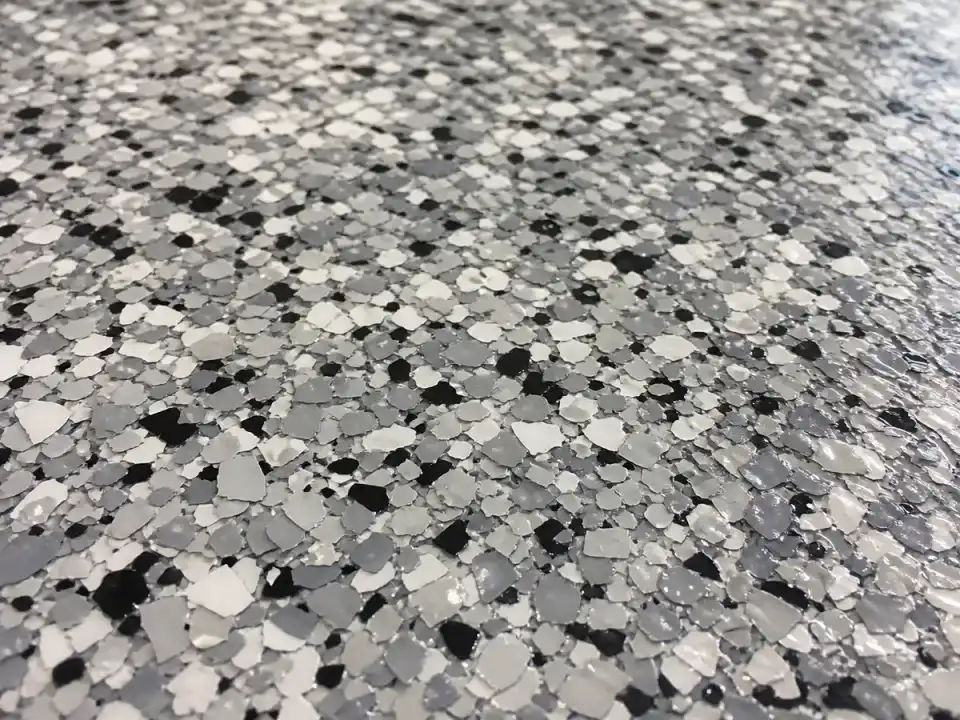 Garage Glow Final Close-up of gray-and-black decorative flakes in an Atlanta garage coating