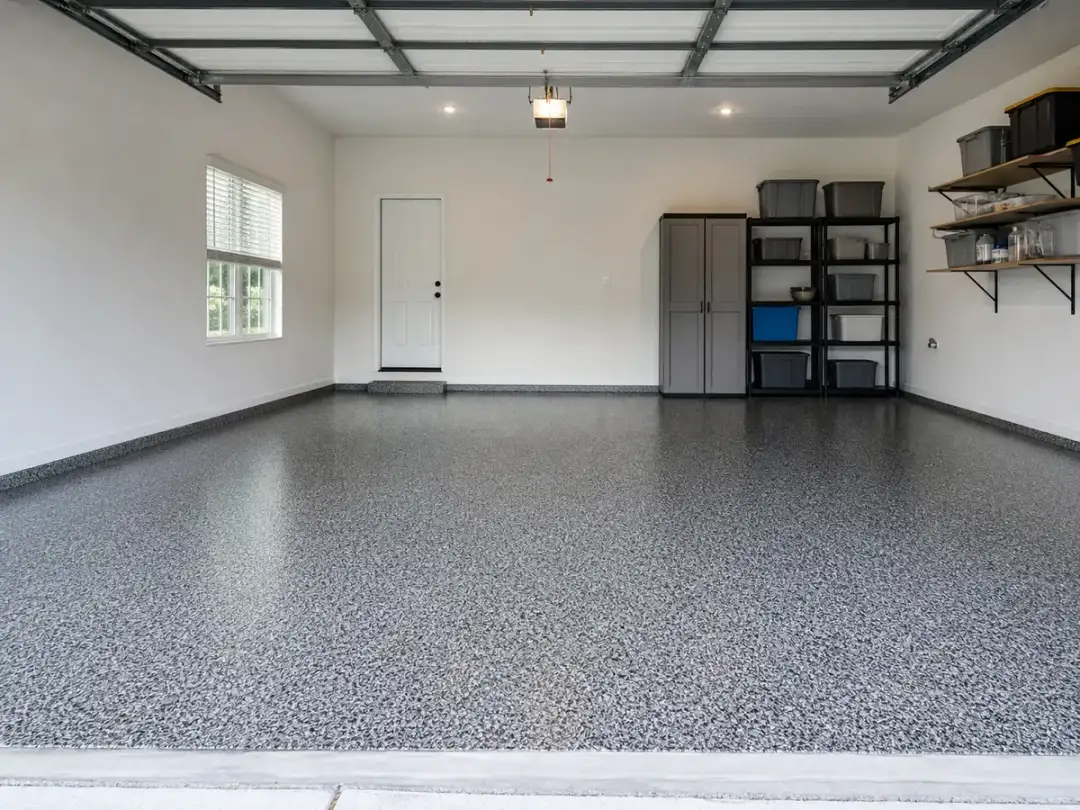 Garage Glow Final Gray-and-black decorative flake coating across a residential Atlanta garage floor
