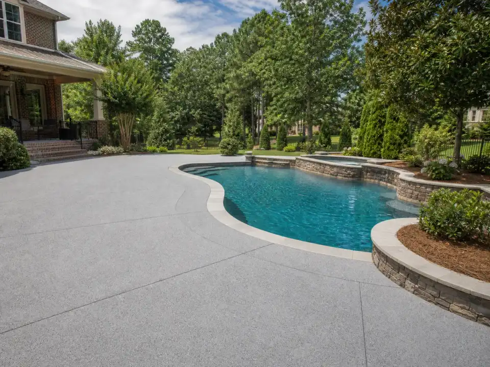 Garage Glow Final Textured concrete coating surrounding a pool deck in Suwanee