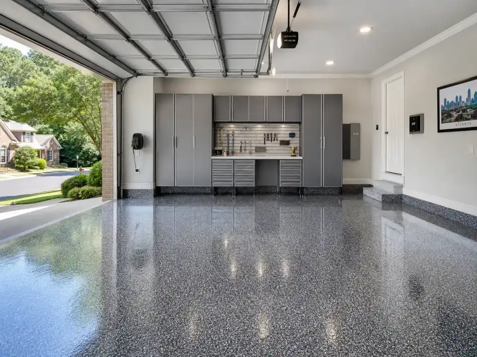 Completed garage floor coating with gray and white flakes