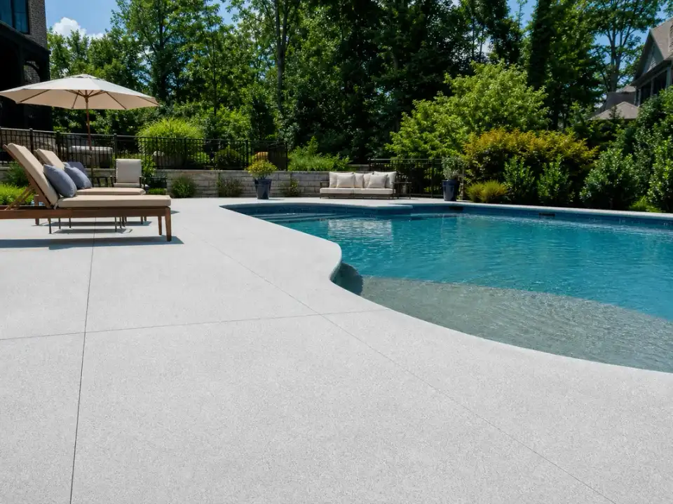 Slip-resistant coated pool deck around a residential pool